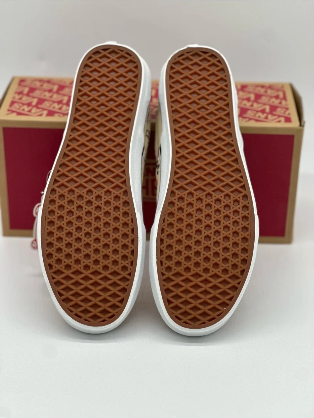 Vans Slip-On Sneakers in Cream, Red & Black Graphic Print